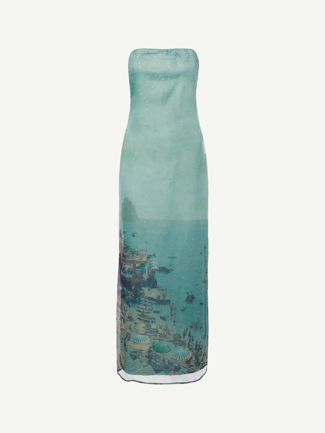 Strapless, floor-length Amara Dress in a sheer, light blue fabric featuring a scenic coastal print of a beach and town, perfect for special occasions.