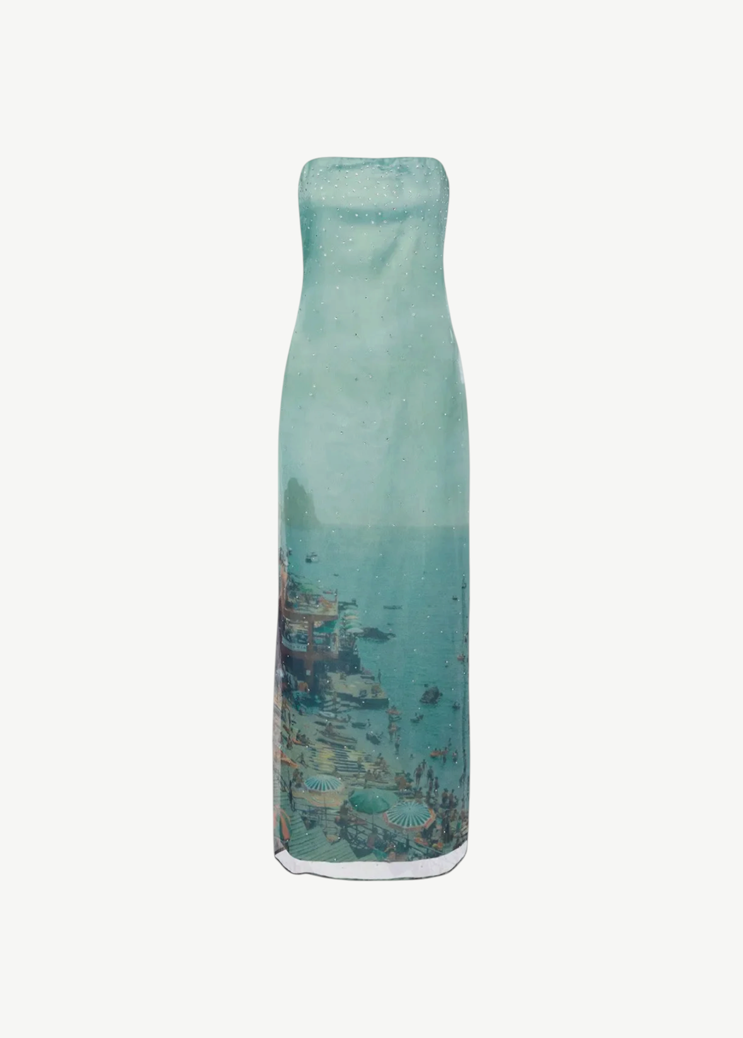 Strapless, floor-length Amara Dress in a sheer, light blue fabric featuring a scenic coastal print of a beach and town, perfect for special occasions.