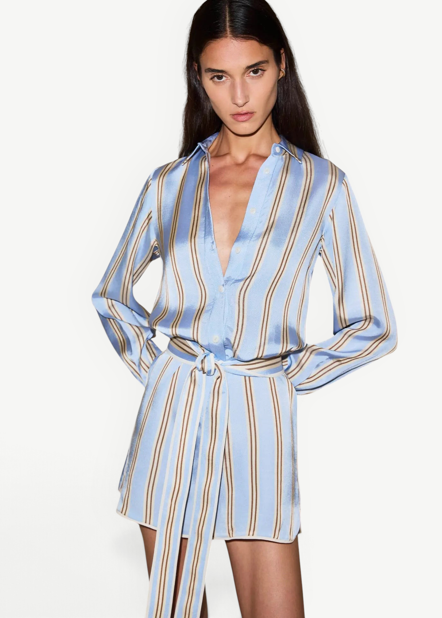 KABE SHOP INC Formentera romper in light blue with vertical brown stripes, collared neckline, and self-tie waist.