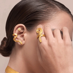 KABE SHOP INC Whichyi ring in gold with organic fluid shape worn by a model with matching ear cuff and choker