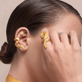 KABE SHOP INC Whichyi ring in gold with organic fluid shape worn by a model with matching ear cuff and choker