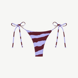 Introducing the Praia Bottom: a bikini bottom with maroon and light purple diagonal stripes, featuring adjustable side ties with bows on both hips, crafted from our eco-friendly Peach Perfect swimwear fabric.