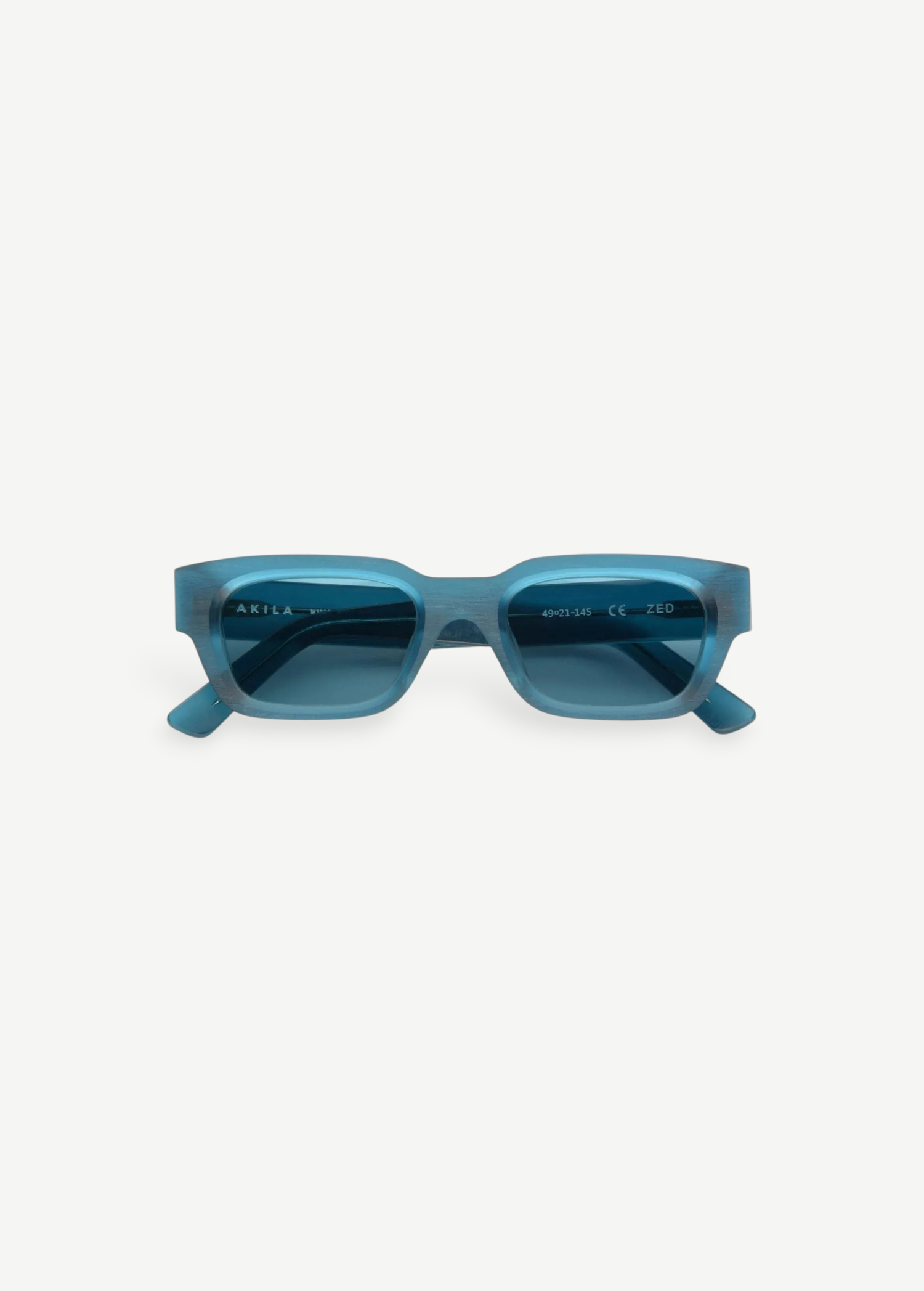 KABE Zed sunglasses featuring a retro-inspired blue translucent wraparound frame from the AKILA RAW collection