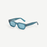 KABE Zed sunglasses featuring a retro wraparound silhouette in a translucent blue matte finish.
