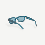 KABE Zed sunglasses in translucent blue with a retro wraparound frame design and unique raw finish.